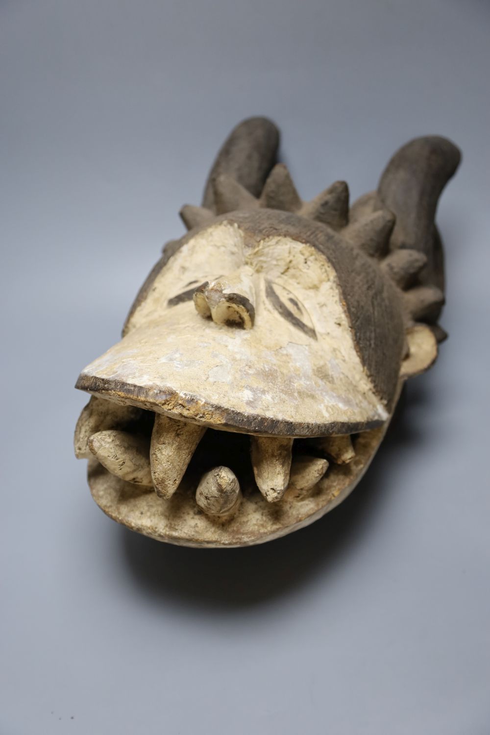 An Igbo painted wood horned mask, Nigeria
